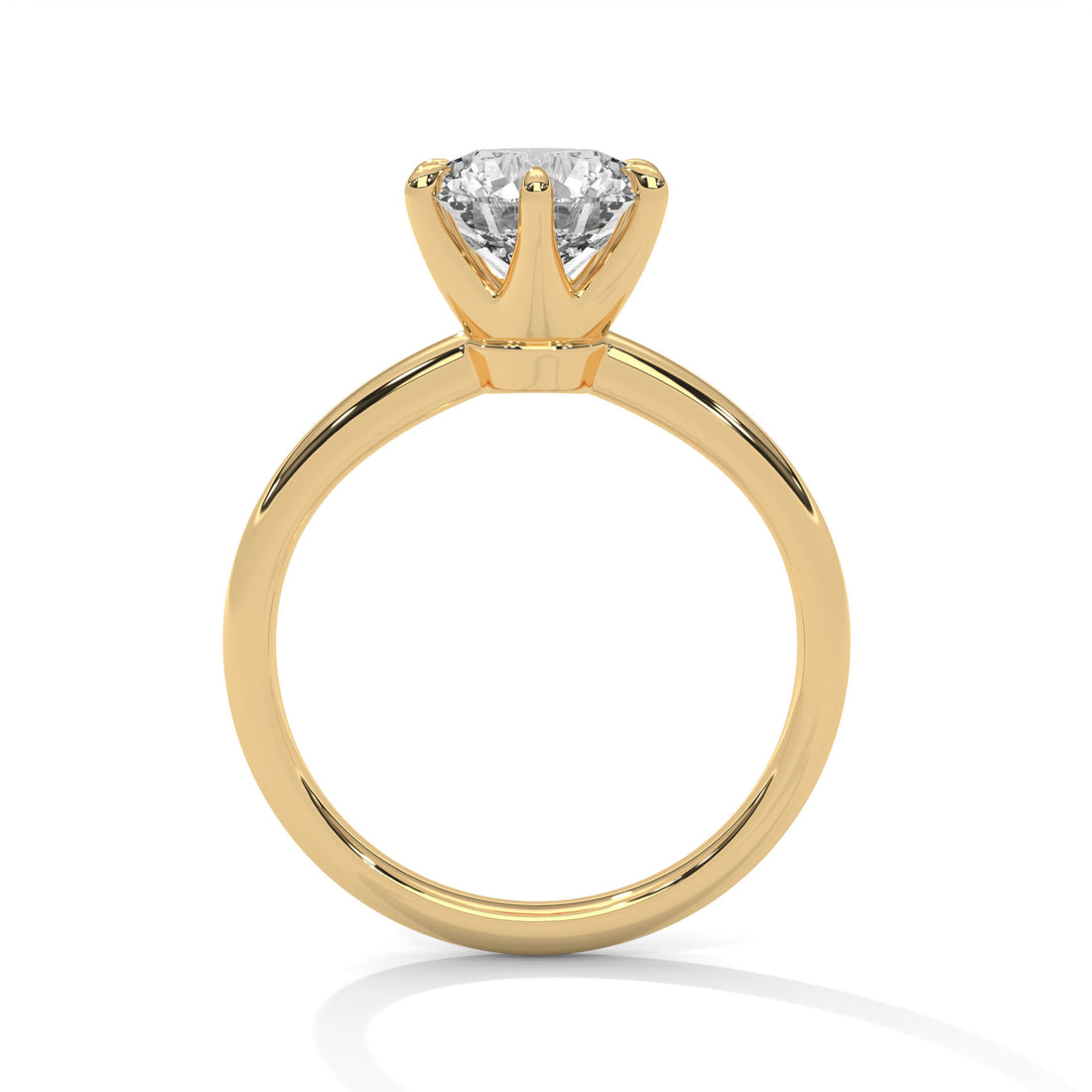 Gold ring with a diamond on a white background