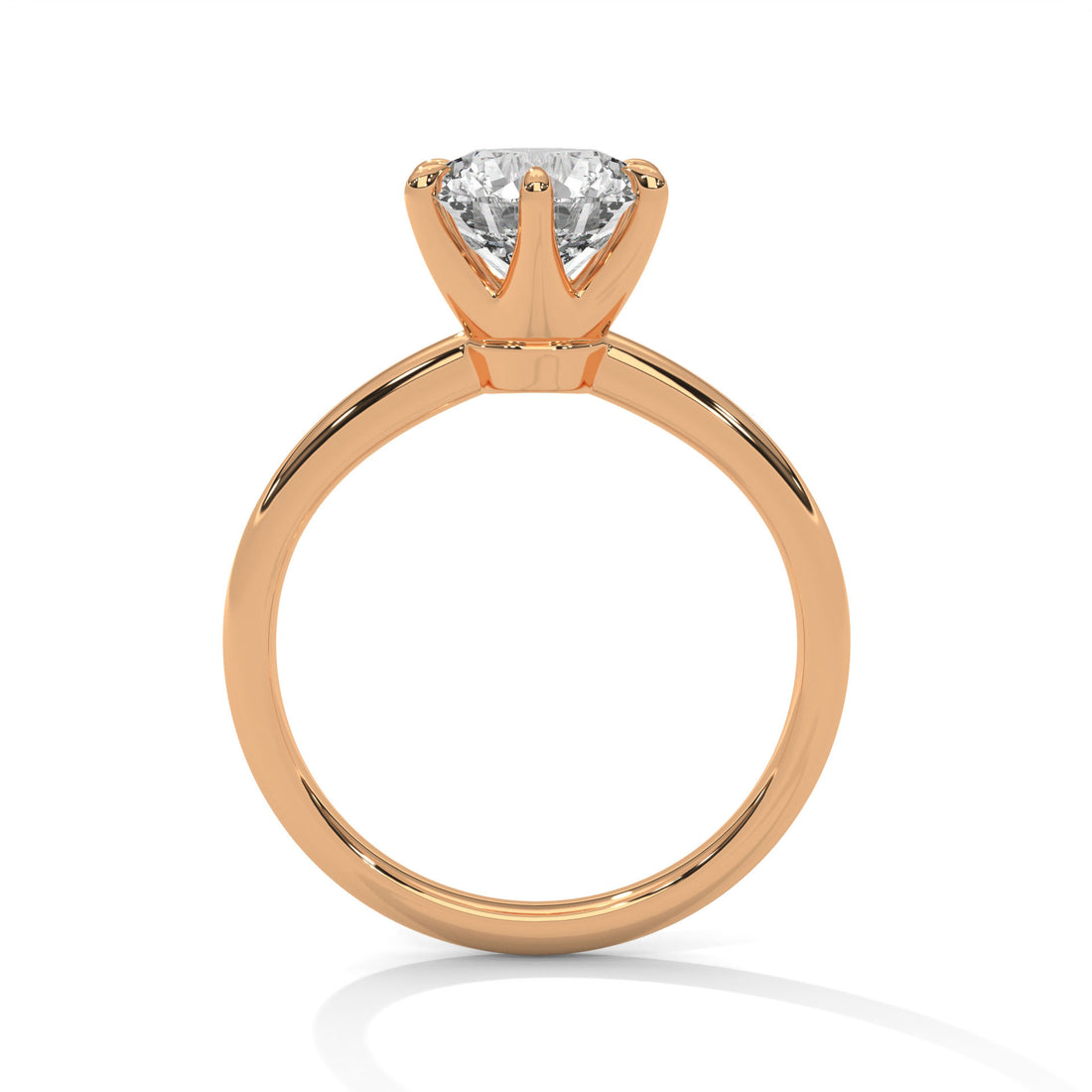 Rose gold ring with a diamond on a white background