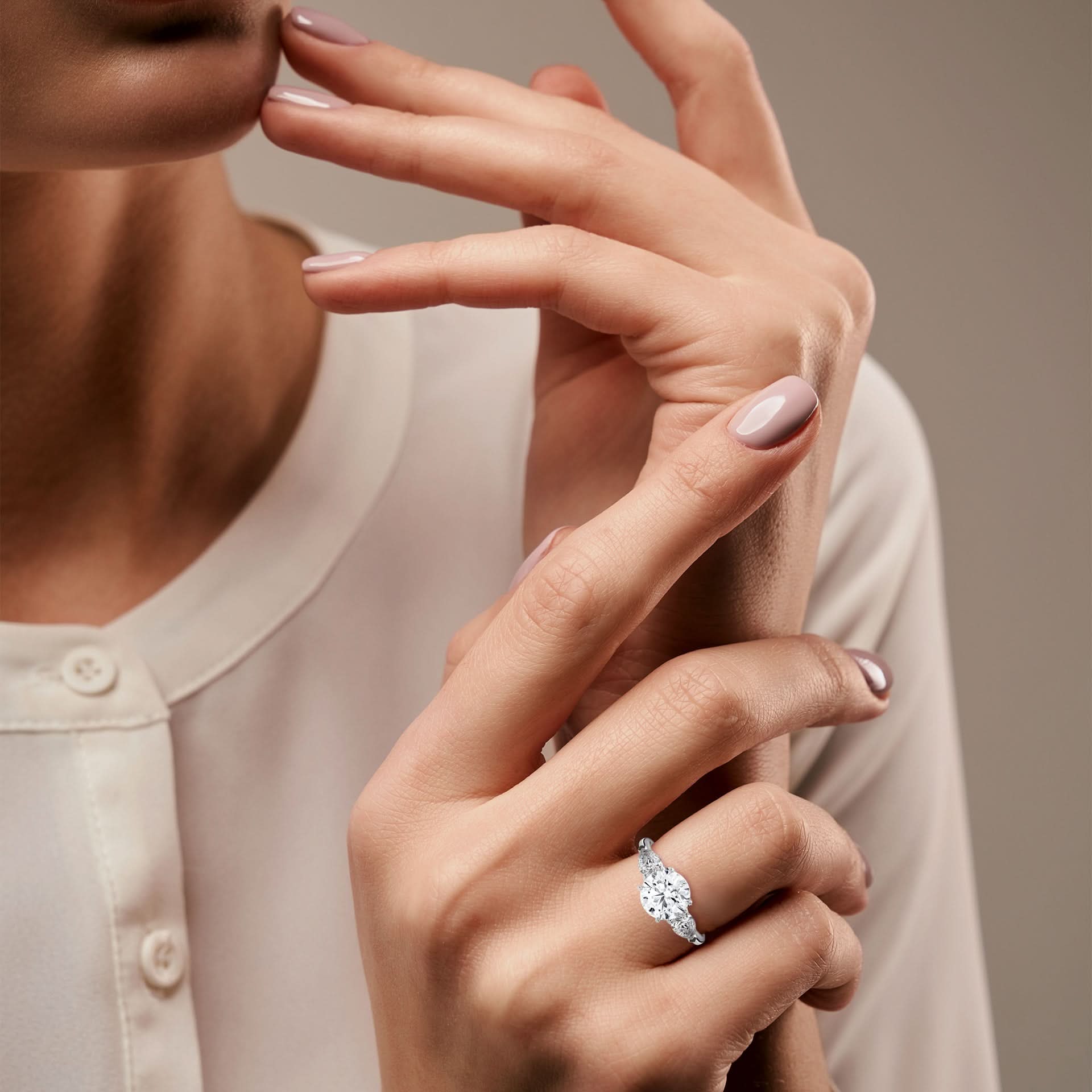Women wearing lab diamond three stone ring