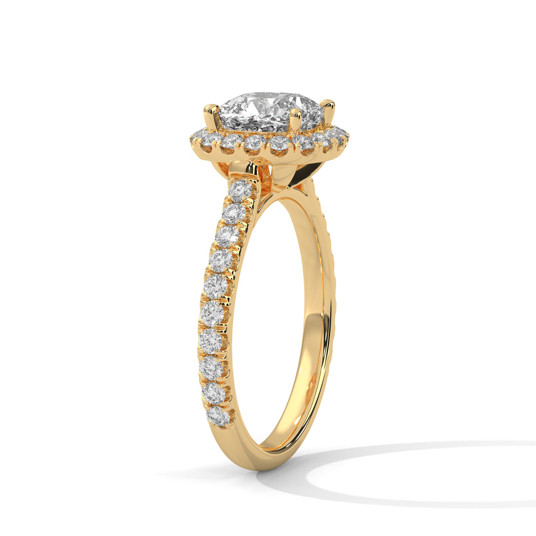Gold ring with a diamond halo and side stones on a white background