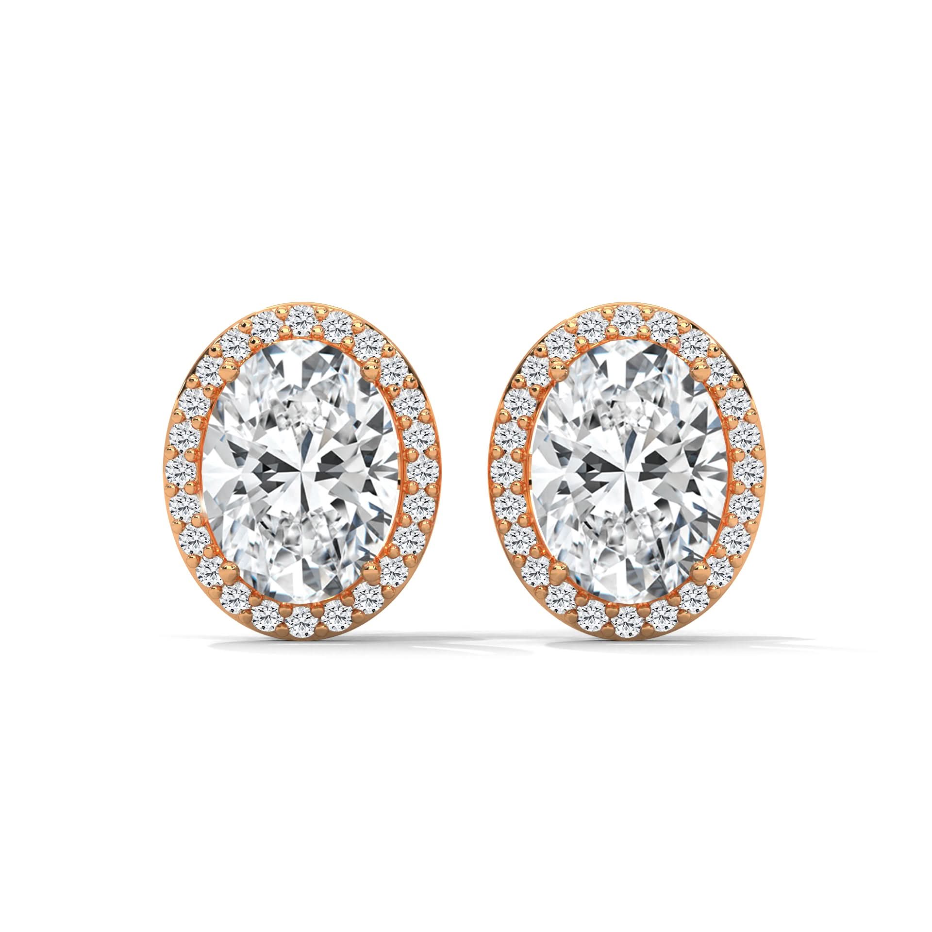 Pair of diamond earrings with rose gold setting on a white background