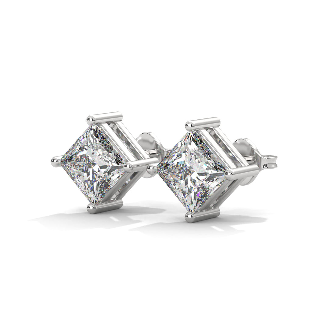 Pair of diamond stud earrings on a white background