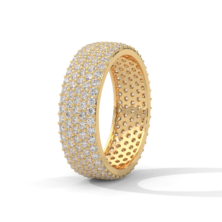 Gold ring with diamond accents on a white background