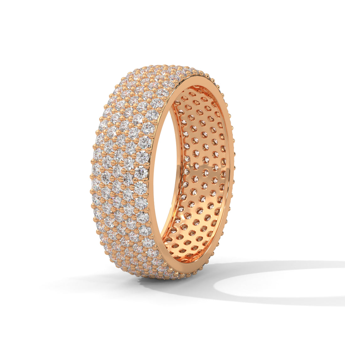Rose gold ring with diamond accents on a white background
