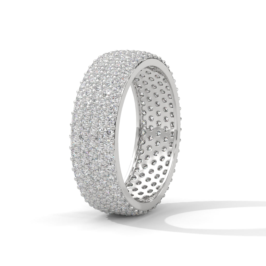 Silver ring with embedded stones on a white background