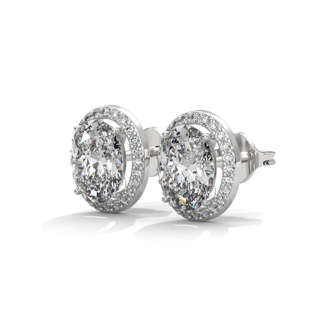 Pair of oval lab diamond stud earrings on a white background