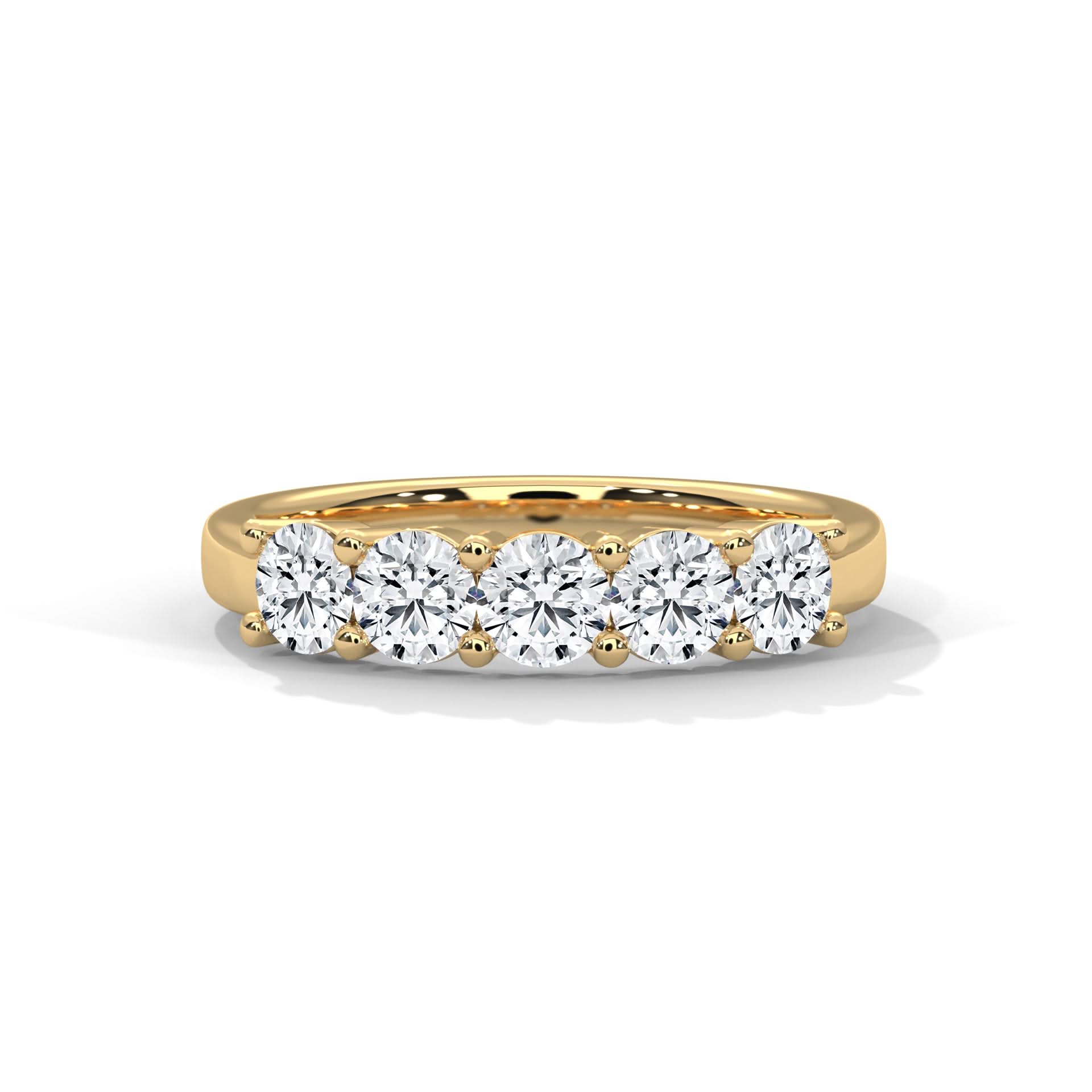 Gold ring with five diamonds on a white background