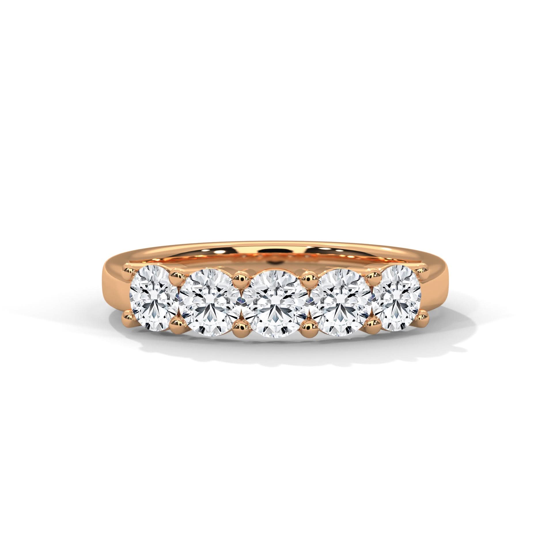 Rose gold ring with five diamonds on a white background