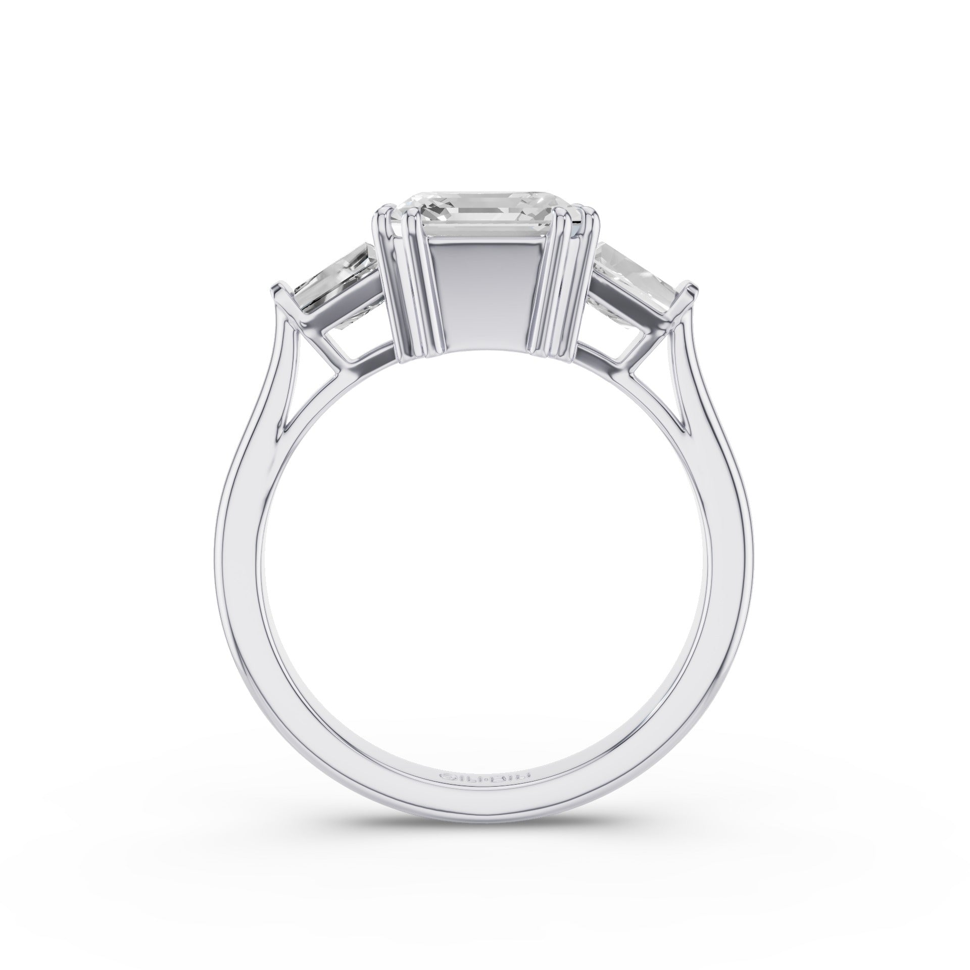 A three-stone diamond ring in a polished silver-colored metal, featuring a central rectangular Asscher cut diamond flanked by two smaller tappered-cut diamonds, shown against a plain white background.