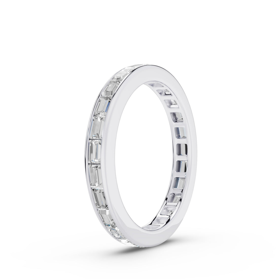 A silver eternity ring featuring a continuous channel setting of clear baguette-cut gemstones, shown at a three-quarter angle on a clean white background.