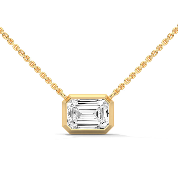 Gold necklace with a diamond pendant on a white background