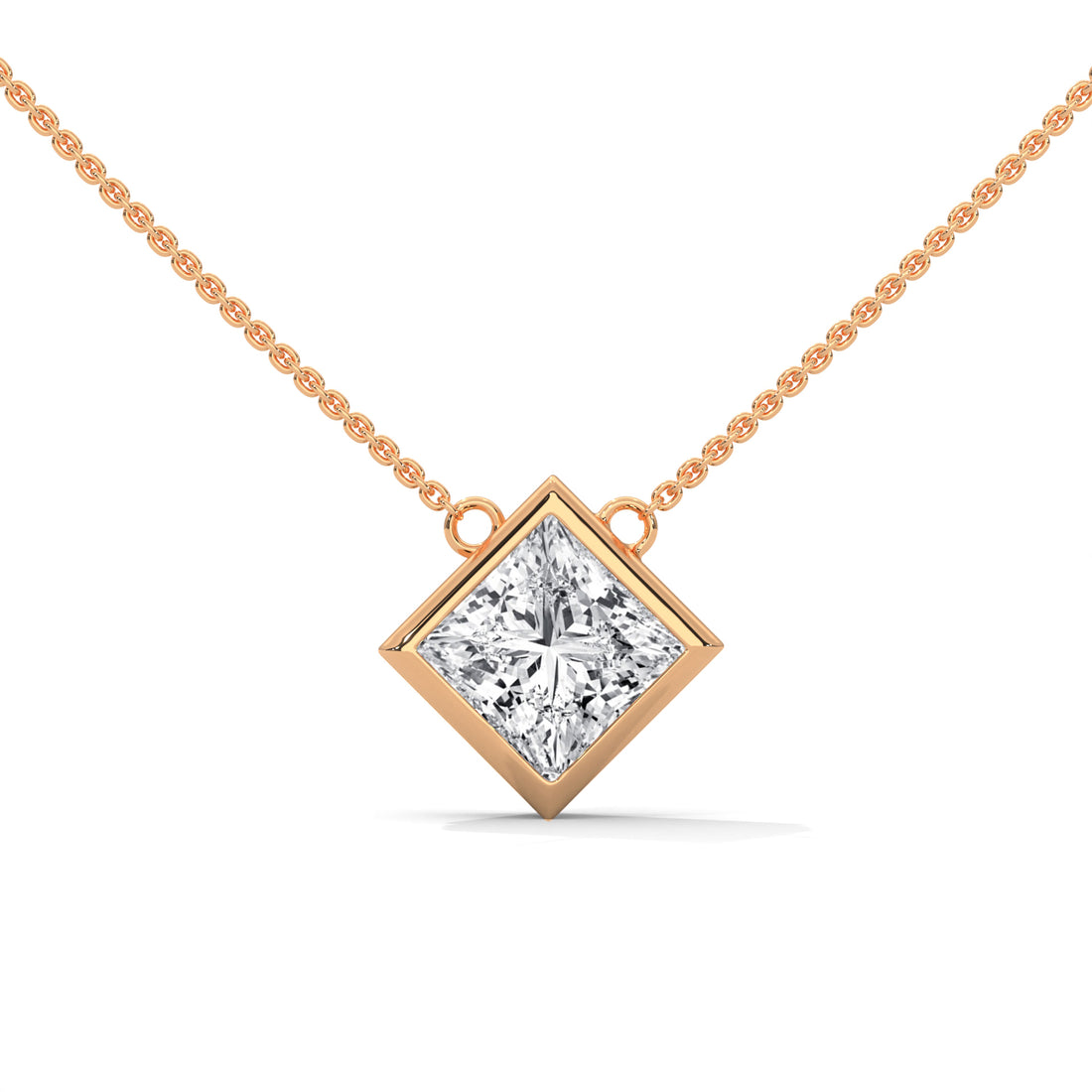 Rose gold necklace with a princess cut  diamond pendant on a white background