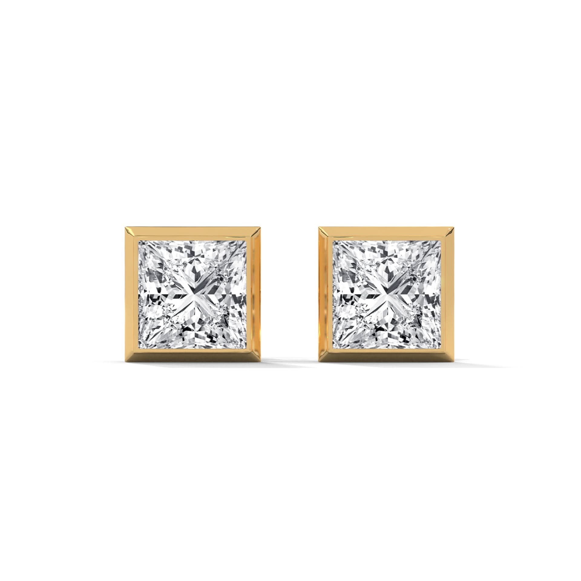 Pair of diamond stud earrings with gold prongs on a white background