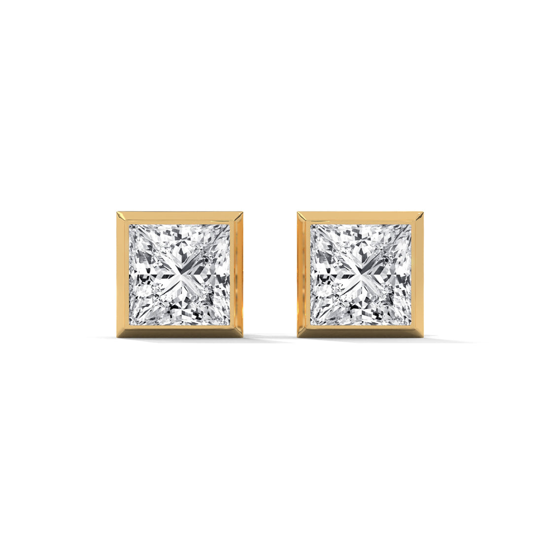 Pair of diamond stud earrings with gold prongs on a white background