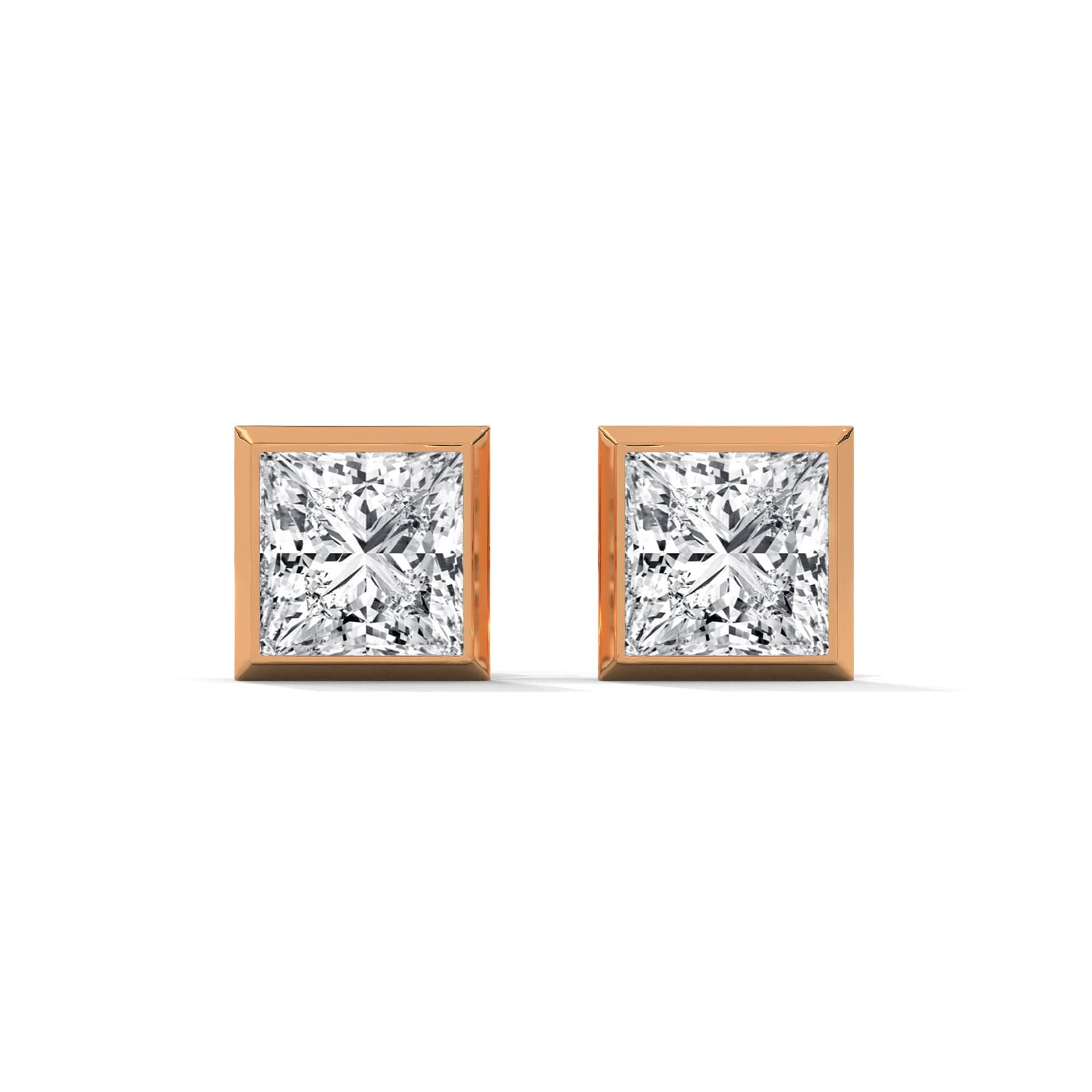 Pair of diamond stud earrings on a white background