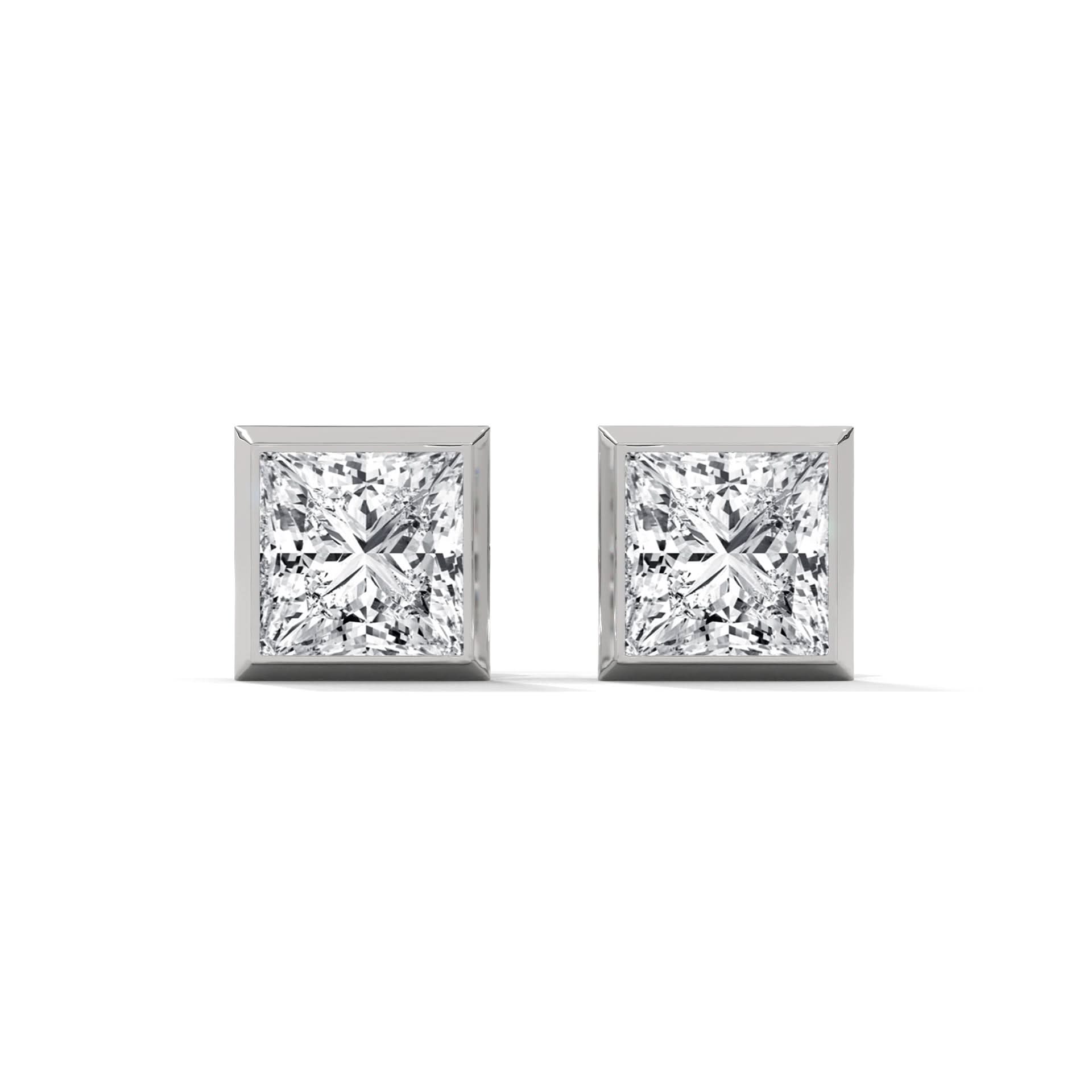 Pair of diamond stud earrings on a white background