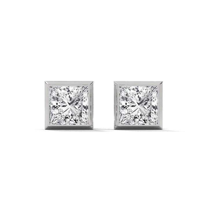 Pair of diamond stud earrings on a white background
