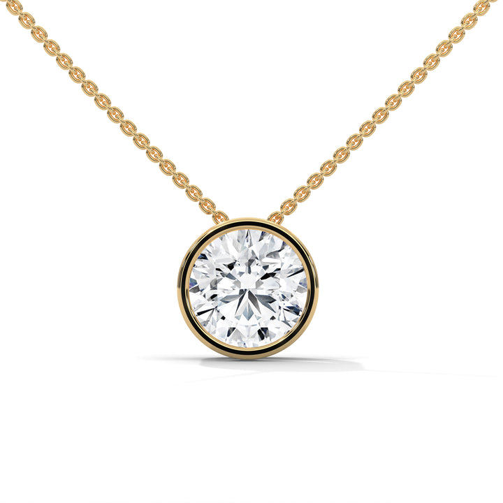 Gold necklace with a round diamond pendant on a white background