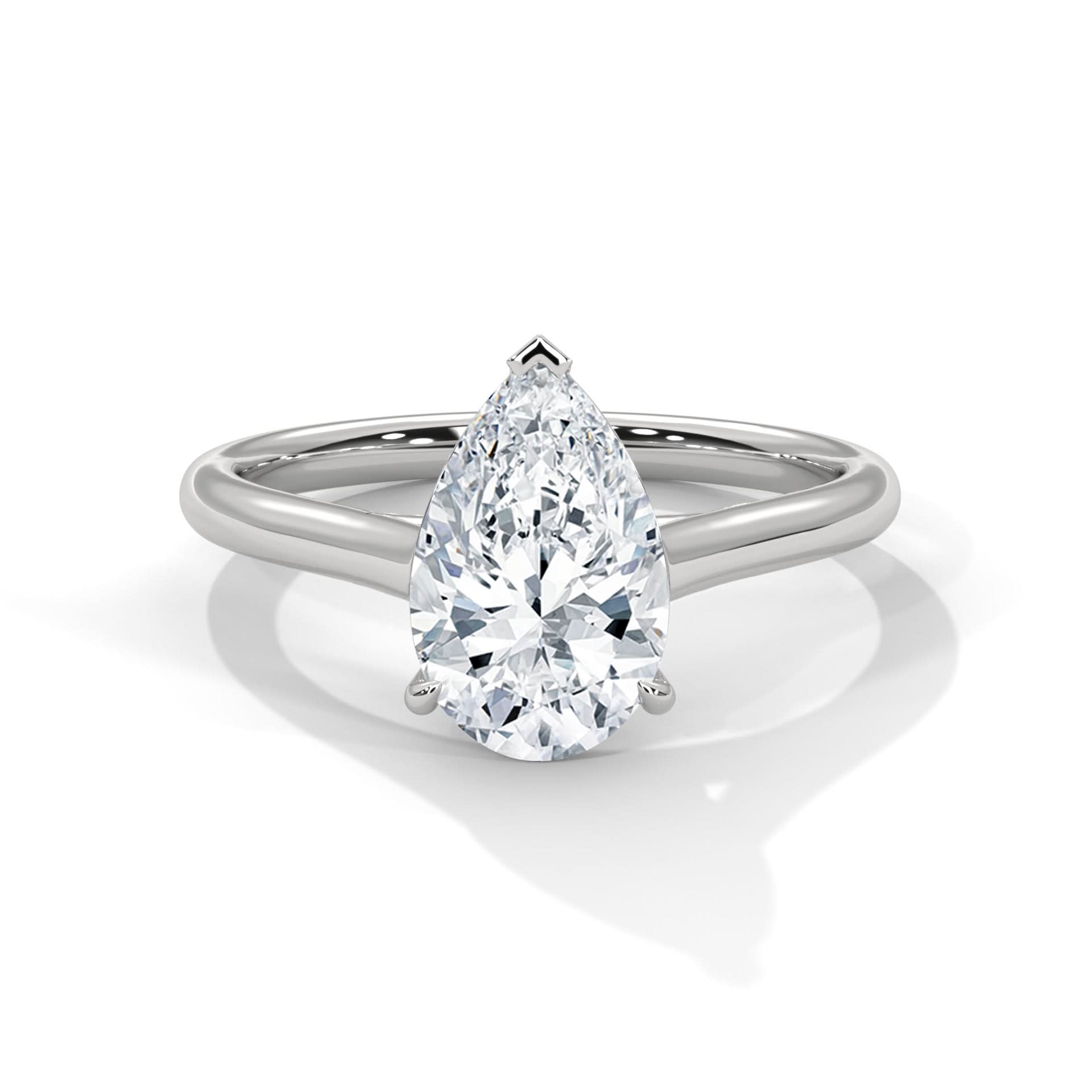 Diamond ring with pear-shaped gemstone on a white background