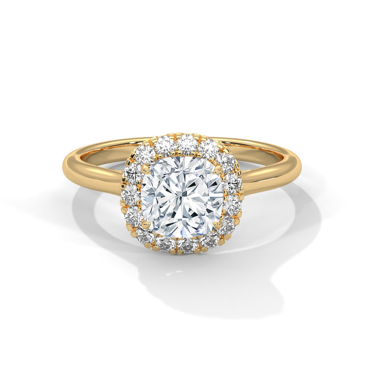 Gold ring with a large diamond and smaller diamonds around on a white background