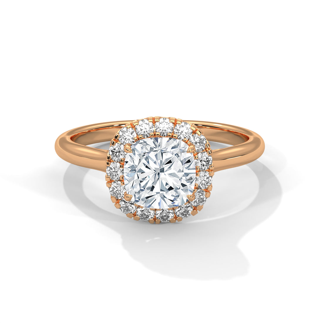 Rose gold ring with a diamond halo on a white background