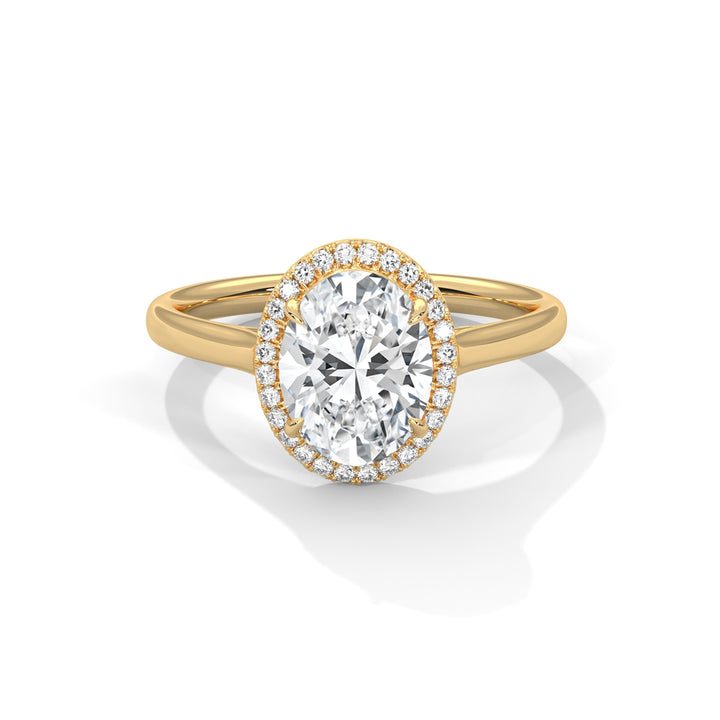 Gold ring with a large diamond and smaller diamonds around on a white background