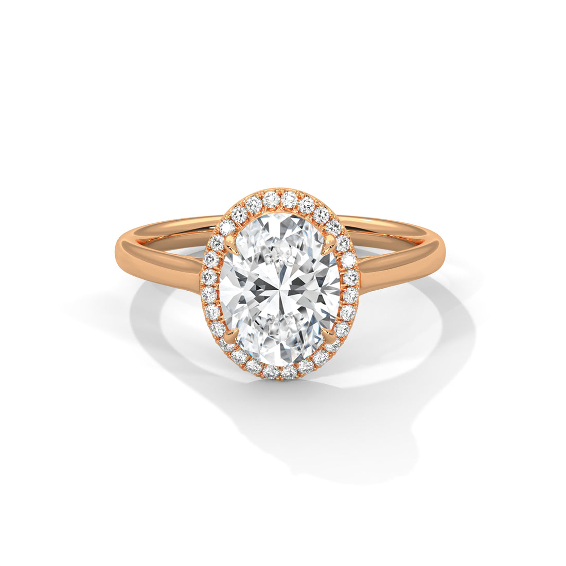 Rose gold ring with a large diamond and smaller diamonds around on a white background
