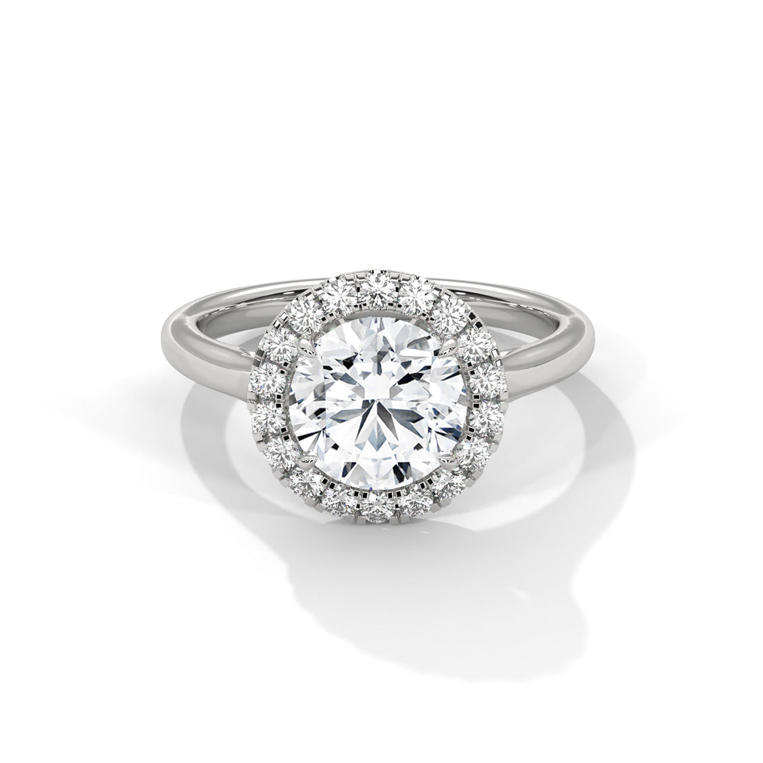 Diamond ring with a halo on a white background