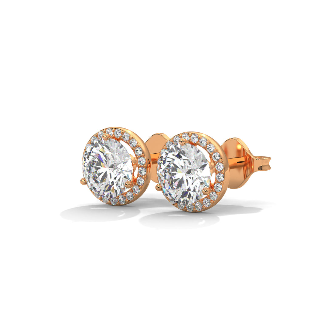 Rose gold earrings with large round lab diamond on a white background