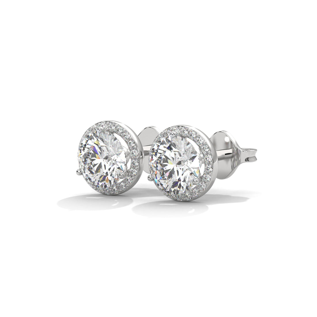 Pair of diamond stud earrings on a white background