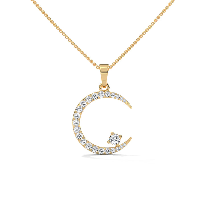 Gold necklace with a crescent moon pendant on a white background