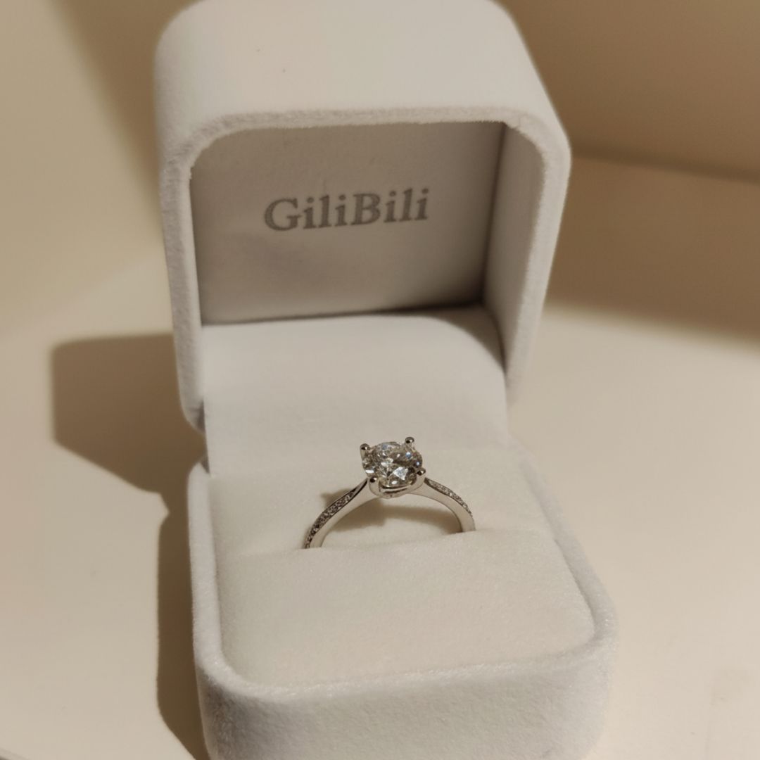 3 ct lab diamond ring in a GiliBili box on a beige background