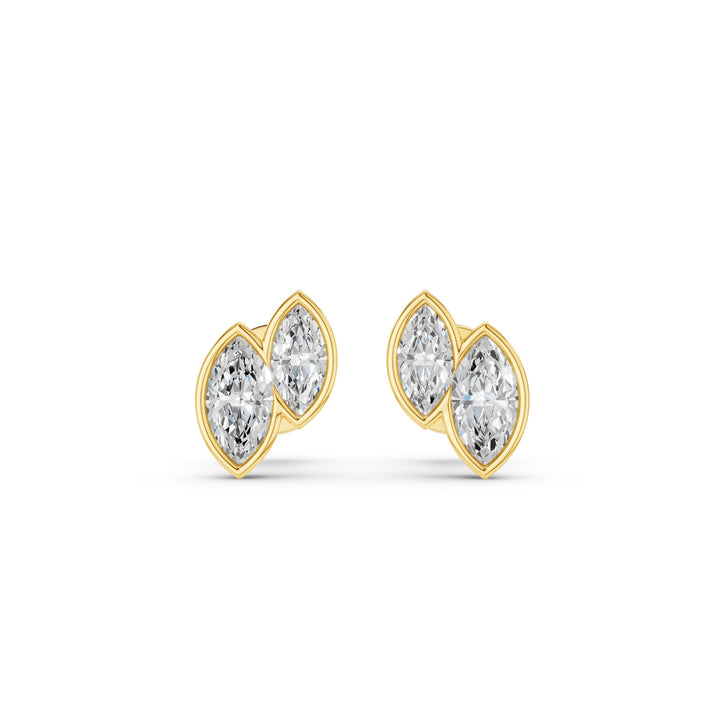 A pair of gold stud earrings featuring marquise-cut clear gemstones in a clustered setting, shown on a plain white background.