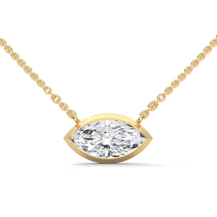 Gold necklace with a diamond pendant on a white background