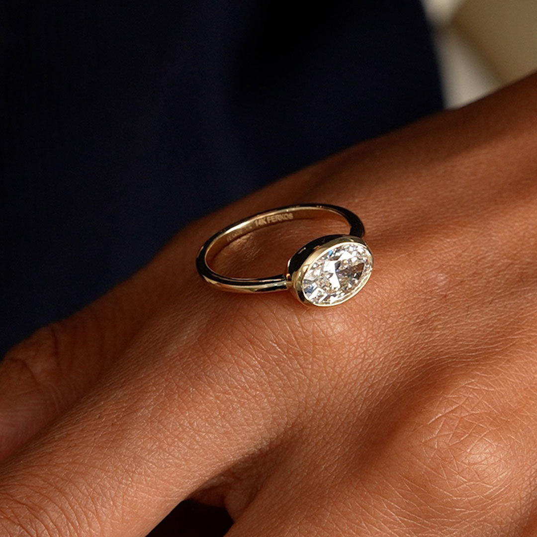 East West Classic Oval Shaped Lab Diamond Bezel Set Engagement Ring
