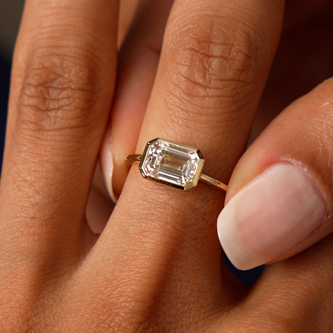 East West Emerald Cut Lab Grown Bezel Setting Engagement Ring