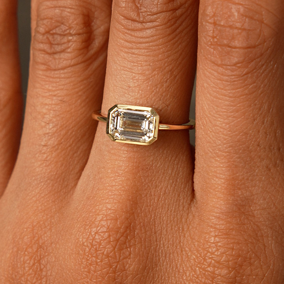East West Emerald Cut Lab Grown Bezel Setting Engagement Ring