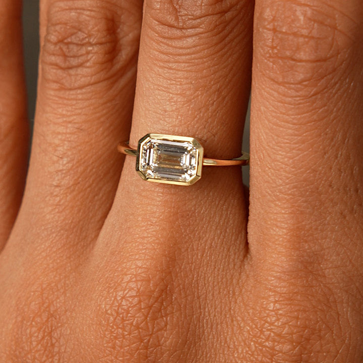 East West Emerald Cut Lab Grown Bezel Setting Engagement Ring