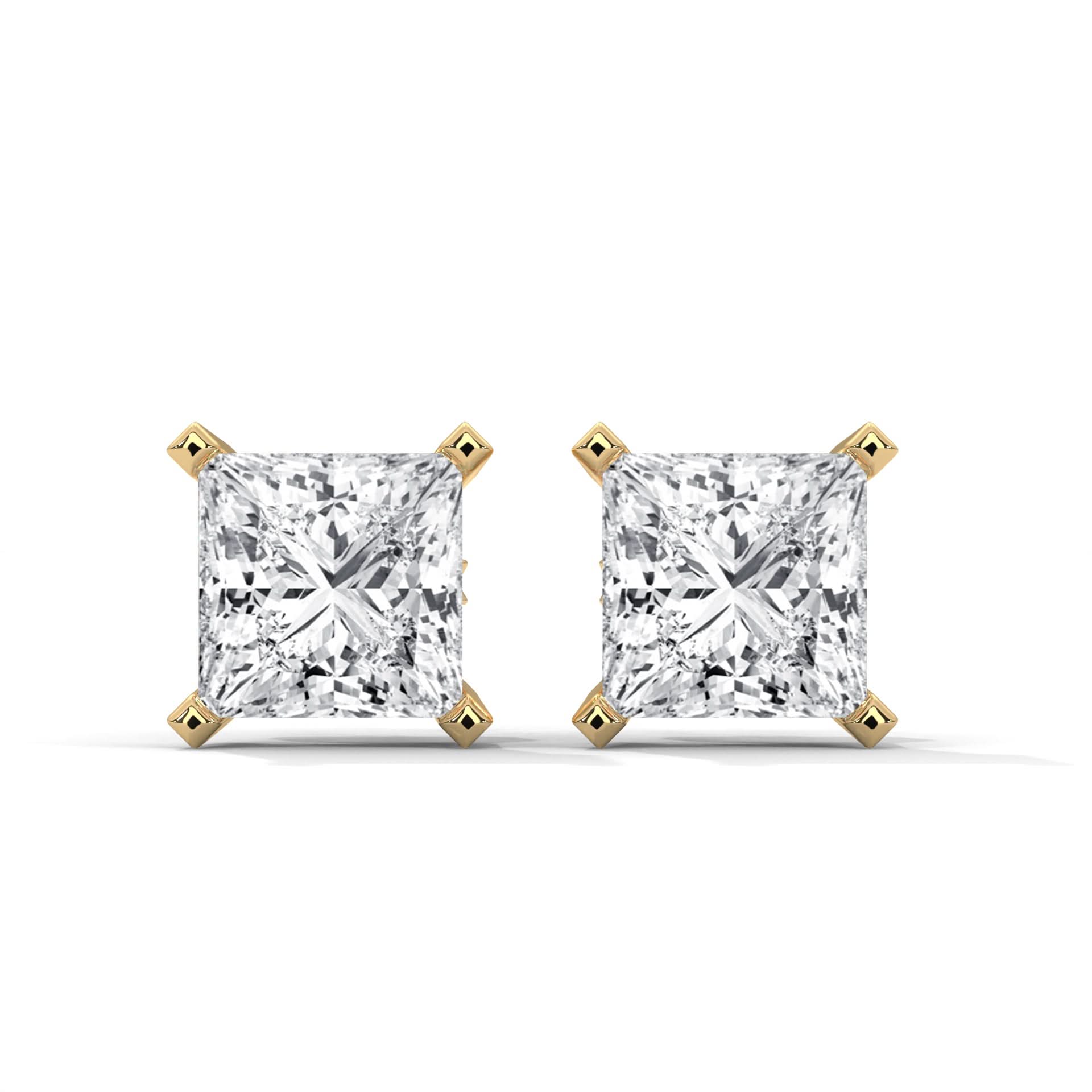 Pair of diamond stud earrings on a white background