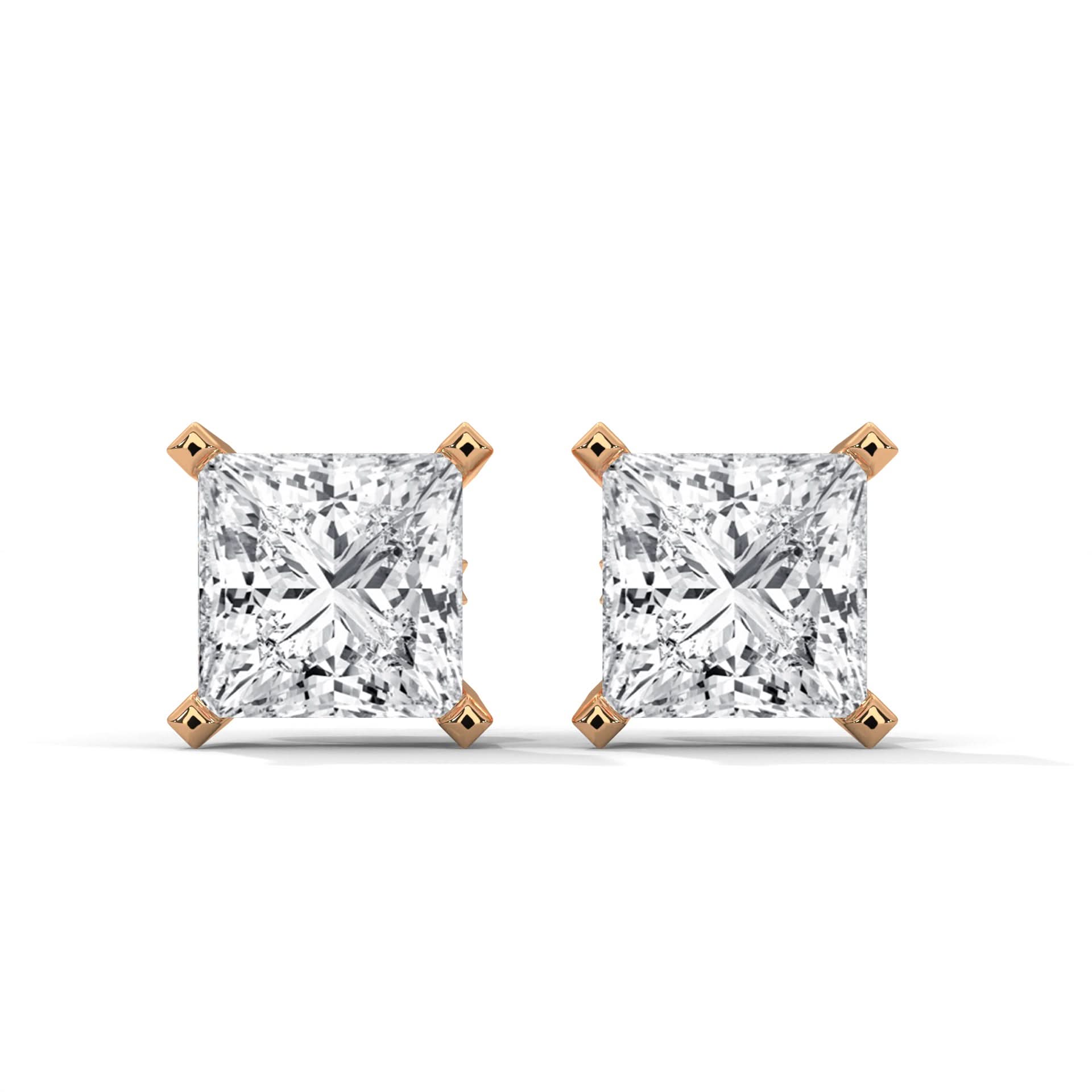 Pair of diamond stud earrings with rose gold prongs on a white background