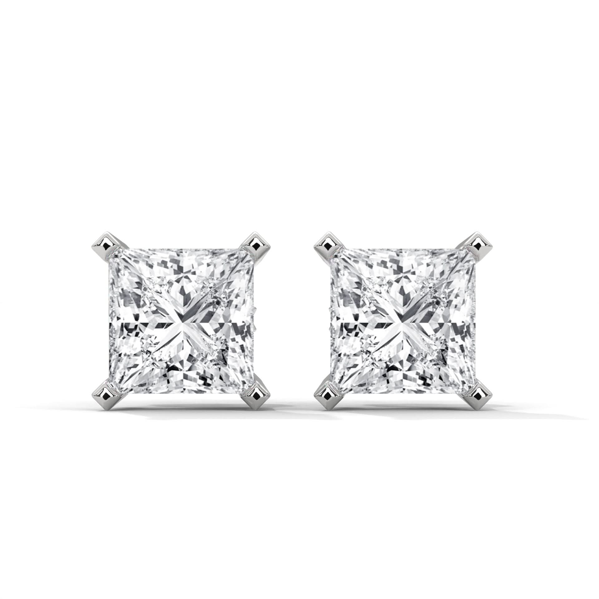 Pair of diamond stud earrings on a white background