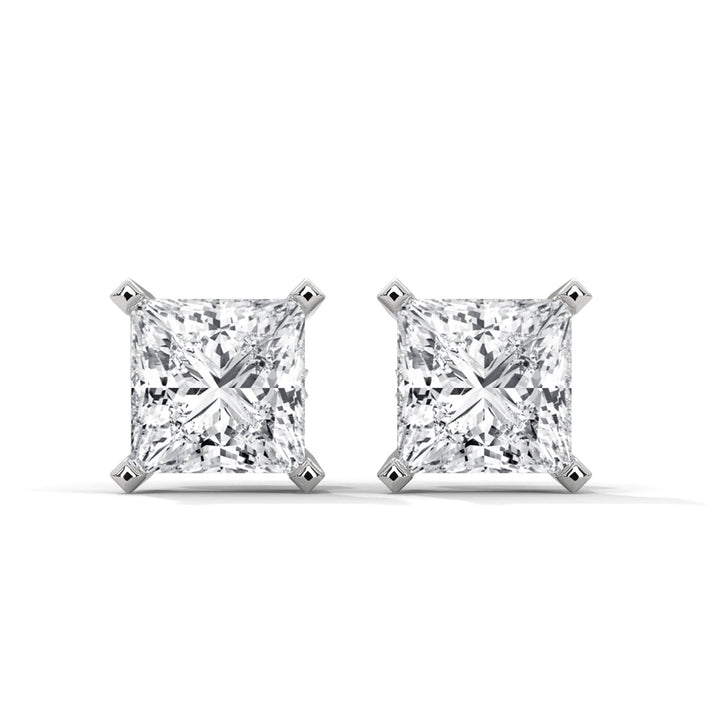 Pair of diamond stud earrings on a white background