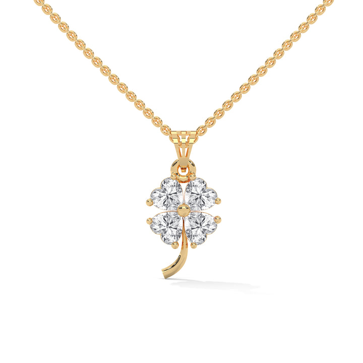 Gold necklace with a four-leaf clover pendant on a white background