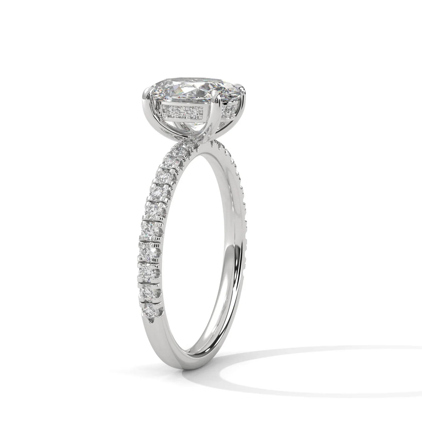 Oval Hidden Halo Diamond ring with a white background