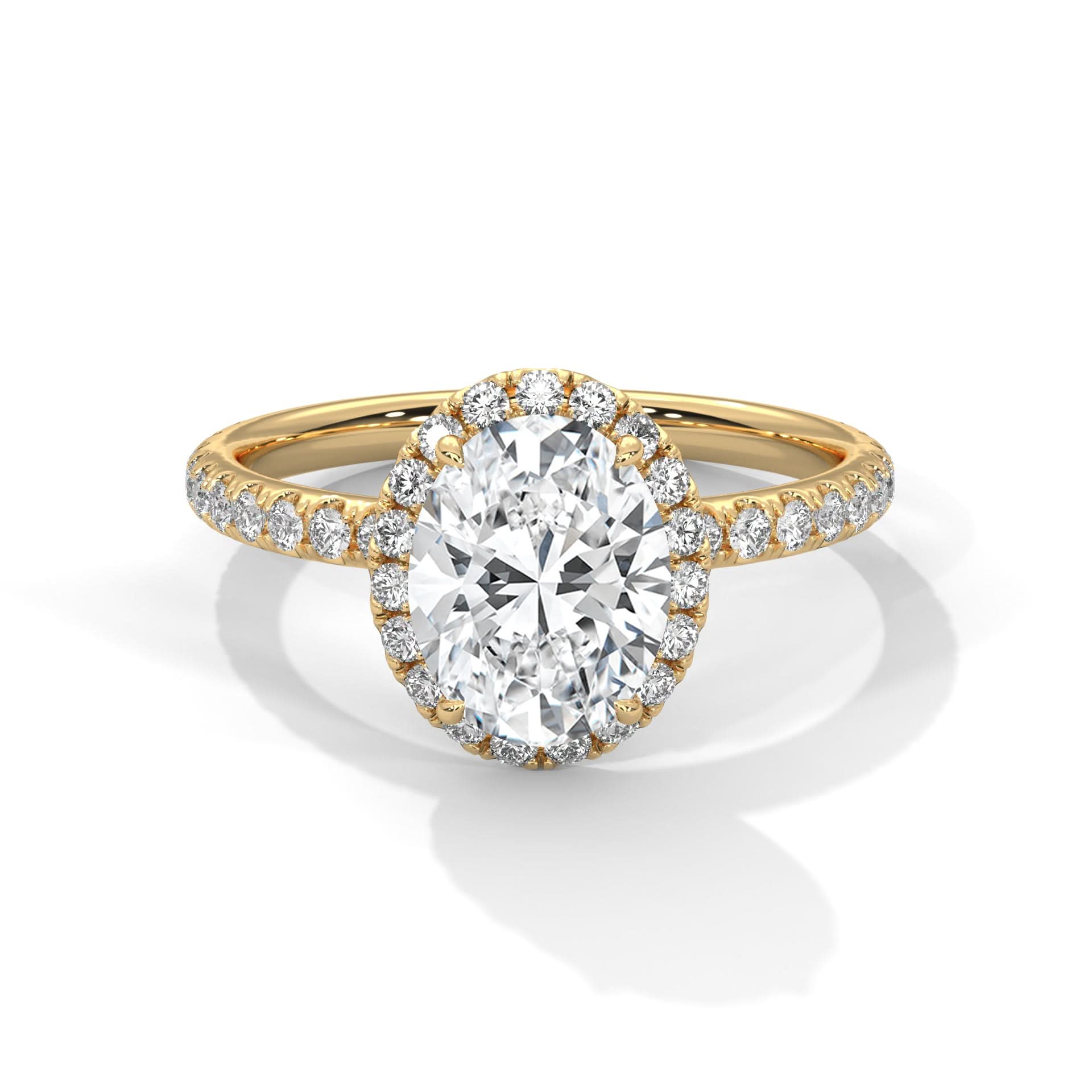 Gold ring with a large diamond and smaller diamonds on the band against a white background
