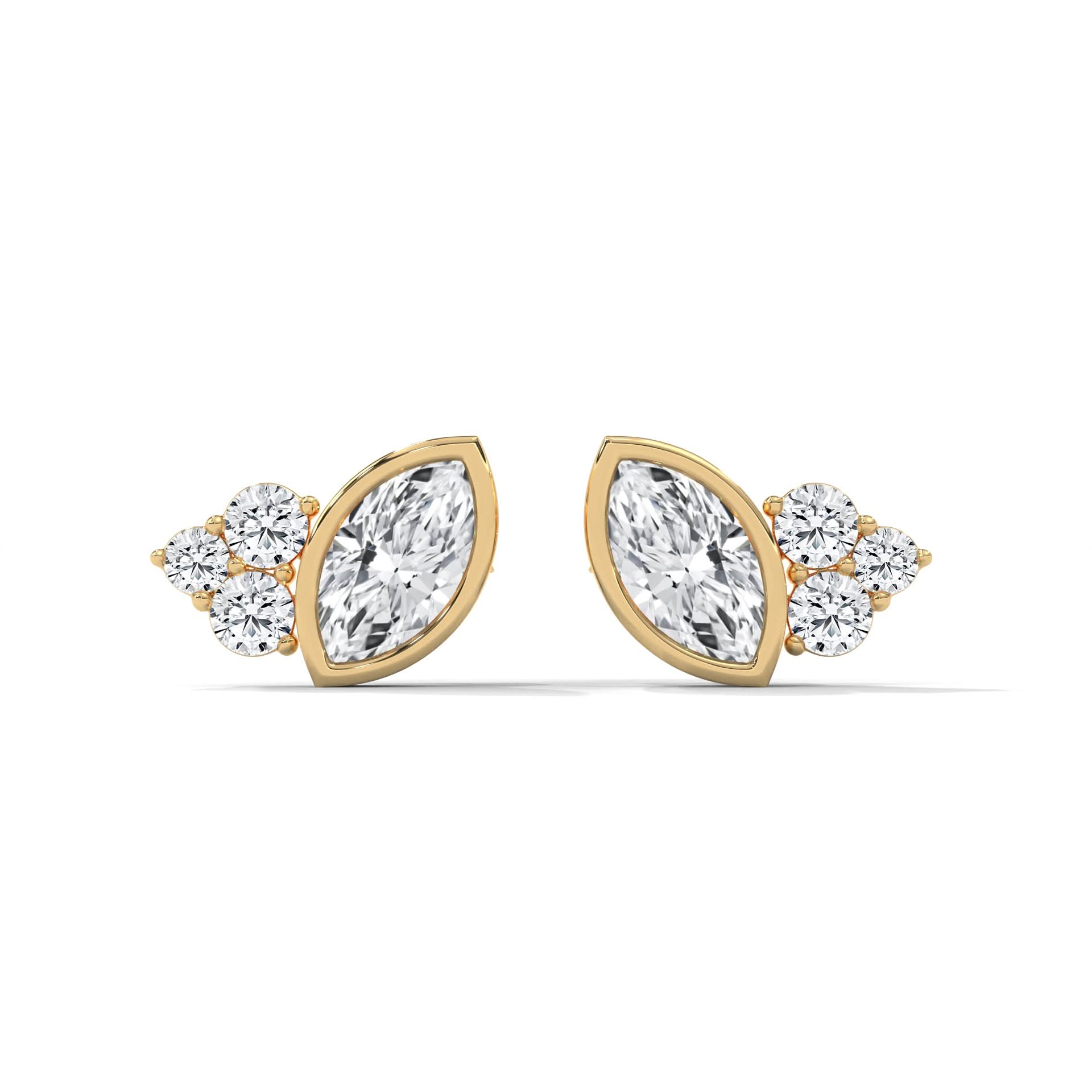Gold and diamond earrings on a white background