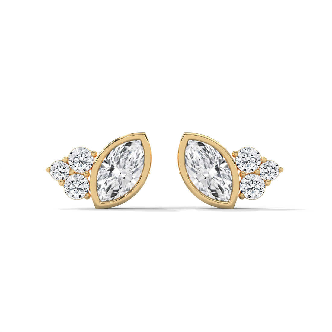 Gold and diamond earrings on a white background