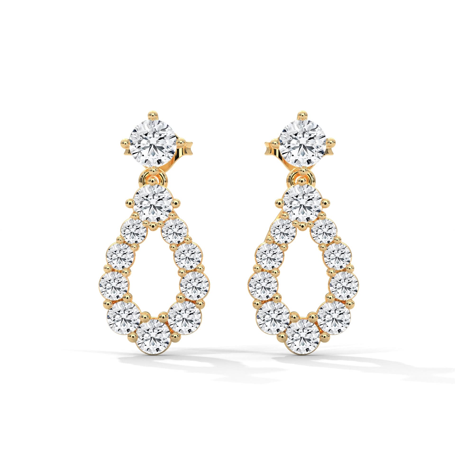 Gold and diamond earrings on a white background