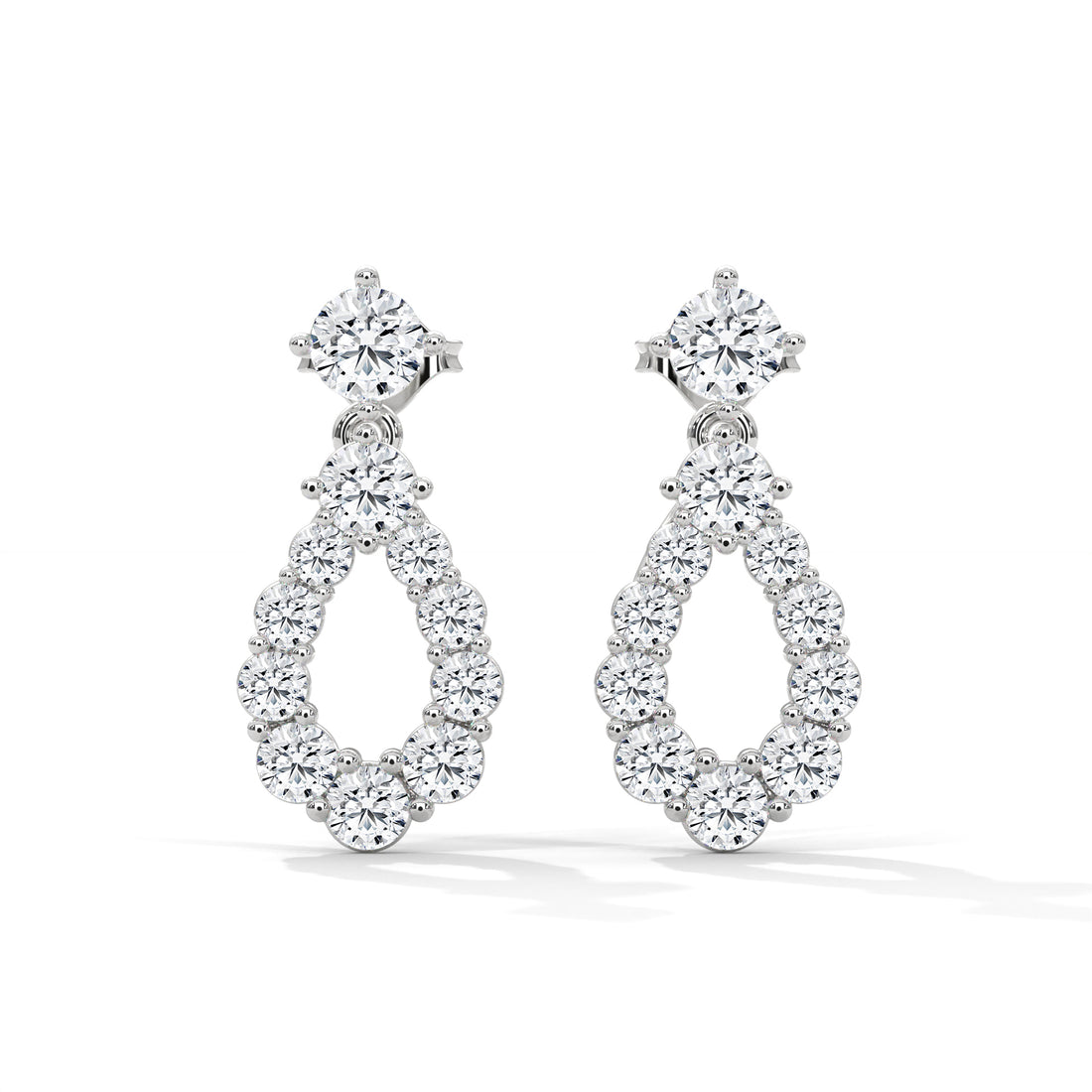 Pair of diamond earrings on a white background