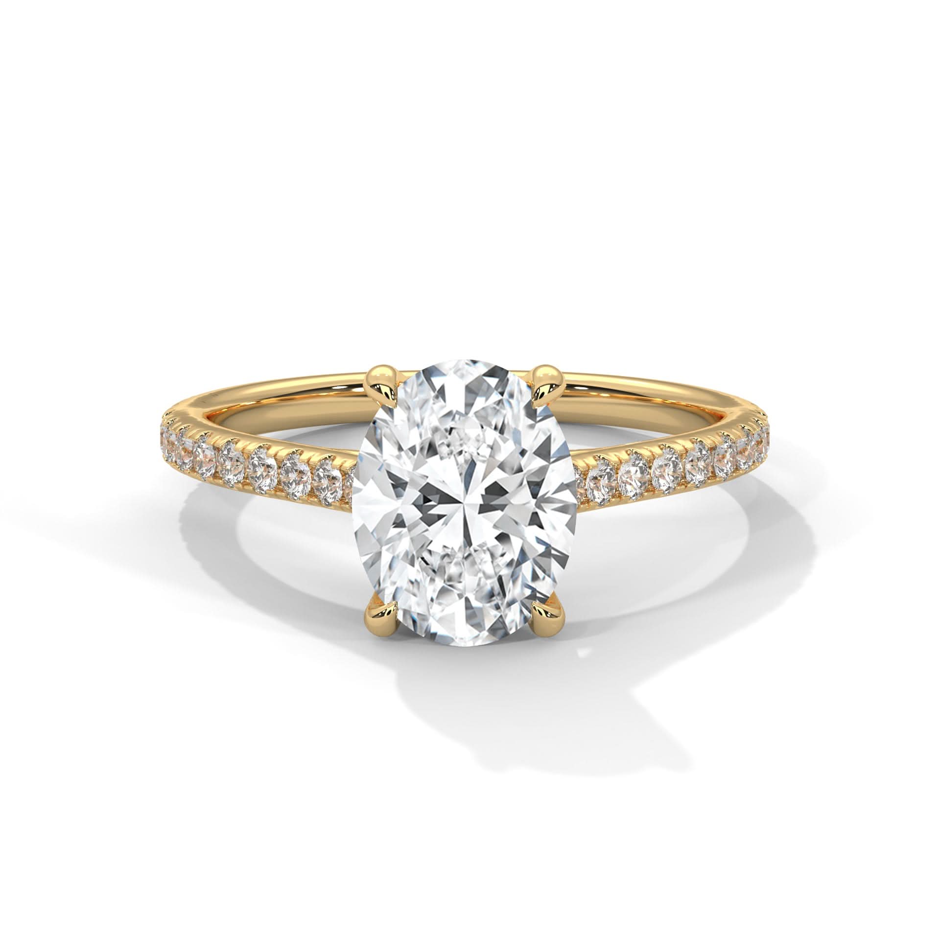 Gold ring with a large diamond and smaller diamonds on the band against a white background